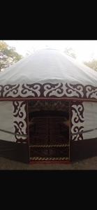 a table with a covering on top of it at Saida guest house in Rybpunkt