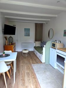 a small room with a kitchen and a living room at Le Sargier in Levens