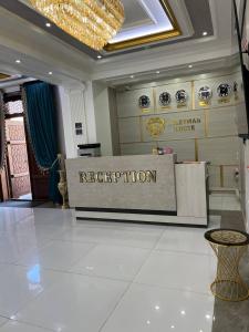 a reception desk in a lobby of a building at Suleyman House Premium in Bukhara
