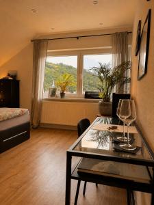 a living room with a table and a window at Haus Johannes in Braubach