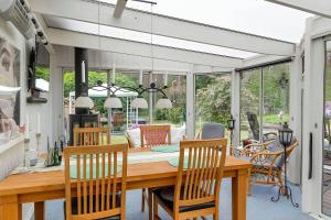 a dining room with a table and chairs at Lindgren Land in Vimmerby