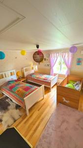 a bedroom with two beds in a room at Lindgren Land in Vimmerby