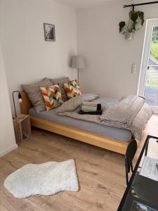 a bedroom with a bed with a wooden frame at Haus Johannes in Braubach +10 photos
