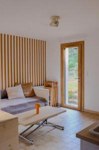 a living room with a couch and a table at La VilLaye in Laye
