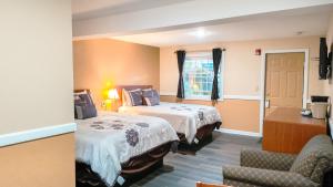 En eller flere senge i et værelse på Briarcliff Motel + 155 billeder