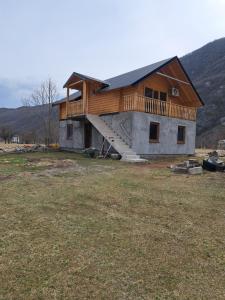 a house with a deck on top of it at Brvnara Nikolija in Šavnik
