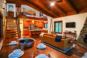 a large living room with a couch and a staircase at Elysian at Mount Baker in Glacier