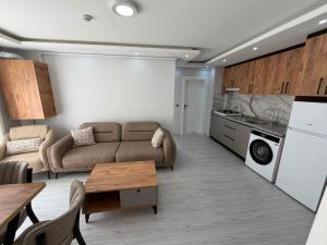 a living room with a couch and a table at Atlas Suite Trabzon in Trabzon