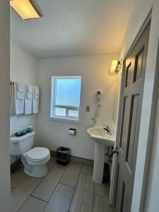 a bathroom with a toilet and a sink at Capitol Hill Motel in Portland +131 photos