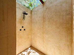 a corner of a room with a window at Loft Bugambilia en Casa Viva Merida in Techoh +12 photos