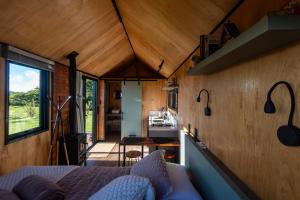 a view from the bedroom of a tiny house at Tiny House - Rancho Queimado SC - 15 Min do centro in Rancho Queimado