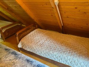 a bedroom with two beds in a attic at The Meridian in Valbonë