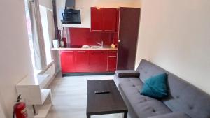 a living room with a couch and a table at Milverton Court by OYO in Manchester