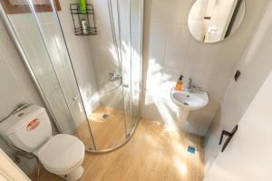 a bathroom with a shower and a toilet and a sink at Natural Villas Trabzon in Komera +52 photos