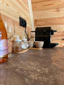 a counter top with a coffee maker and a toaster at Vis de Munte Chalet in Buhalniţa