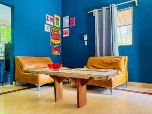a dining room with a table and a chair at Loft Bugambilia en Casa Viva Merida in Techoh