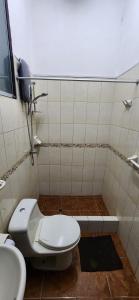 a bathroom with a toilet and a sink at Lima Centro Apartment 3 in Lima