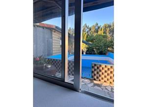 a view of a swimming pool from a window at O cantinho da Esther in Bustos