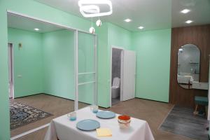a room with a table with blue plates on it at Mountain View in Türgen +59 photos