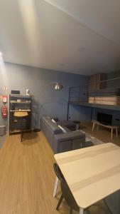 a living room with a couch and a table at Matosinhos Urban Loft in Matosinhos