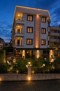 a large building with lights in front of it at Eylül Homes in Trabzon