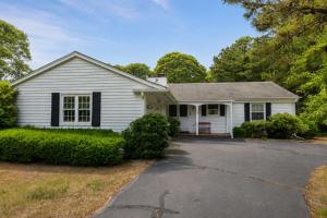 a white house with a driveway at Central AC Game Room Dog-Friendly in Chatham