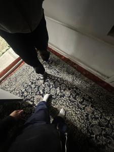 two people are standing on the floor of a room at House in Kyzart +9 photos