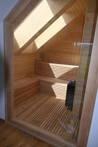 a sauna with a wooden floor and a ceiling at Haus Preber in Mariapfarr