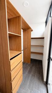 a room with wooden cabinets and a hallway at Bowra World Cup House, Akron Stadium 5 in Guadalajara