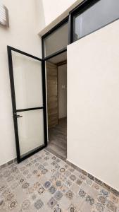 an empty room with a door and a tile floor at Bowra World Cup House, Akron Stadium 5 in Guadalajara +19 photos