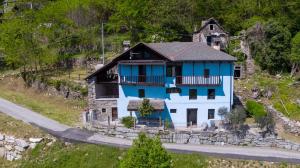 a blue and white house on the side of a road at Residenza Villa Paradiso in Villadossola +38 photos