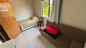 a small room with a small bed and a window at Flat Forte Orange - Ilha de Itamaracá in Itamaracá +36 photos