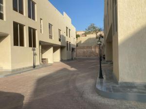 an empty alley with a light pole in a building at فلل دوبلكس - جدة in Jeddah