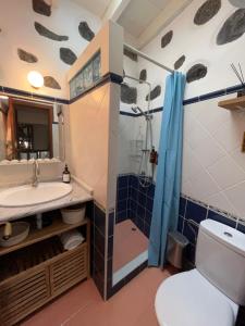 a bathroom with a sink and a toilet and a shower at Casita Drago in Santa Cruz de la Palma +23 photos