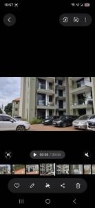 a picture of a car parked in front of a building at CozyStay Homes in Kampala