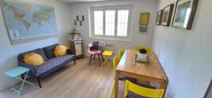 a living room with a couch and a table and chairs at Casa Fery in Contra