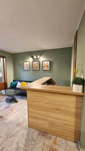 a room with a bed in the corner of a room at D House in Chernomorets