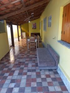 a living room with a couch and a table at Casa Recanto 3 in Campos do Jordão +19 photos