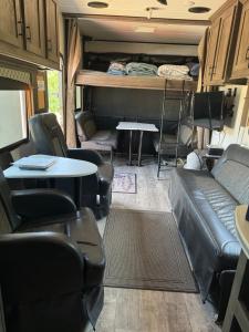 a living room with a couch and chairs and a table at Waxberry Trailer by Kings Canyon and Sequoia National Parks in Squaw Valley