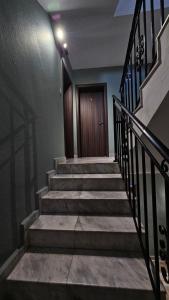 a set of stairs with a door in a building at D House in Chernomorets