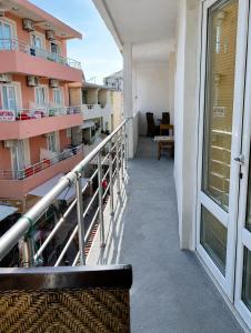a balcony of a apartment with pink balconies at Dodo Obala Apartmani in Sutomore