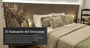 a poster of a bedroom with a bed and pillows at Ocre y Cal in Consuegra +11 photos