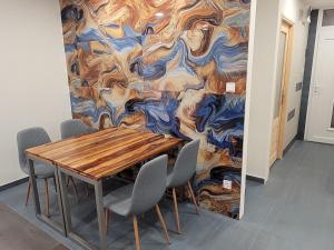 a conference room with a wooden table and chairs at Magic Downtown Szeged in Szeged