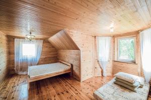 a sauna with a bench in a wooden room at Всім бобра in Pulʼmo