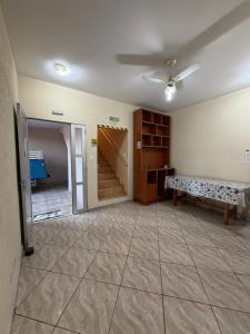 a room with a staircase and a bench in it at Pousada Flor do Vale in São José dos Campos