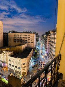a view of a busy city street at night at Yacoubian Suites in Cairo