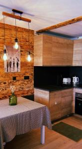 a kitchen with a table in a room at Panorama à La Mongie in La Mongie