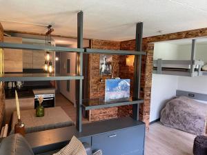 a room with a bunk bed and a room with a bed gmaxwell gmaxwell gmaxwell gmaxwell at Panorama à La Mongie in La Mongie