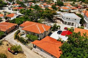 an aerial view of a residential neighborhood with orange roofs at Casa Marrone in Proskinitaí