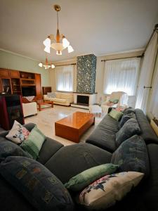 a living room with a couch and a table at Casa Marrone in Proskinitaí